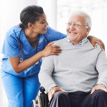 Caregiver assisting senior in wheelchair